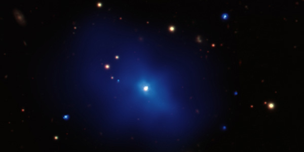 A galaxy cluster with a central quasar located about 8 billion light years away.